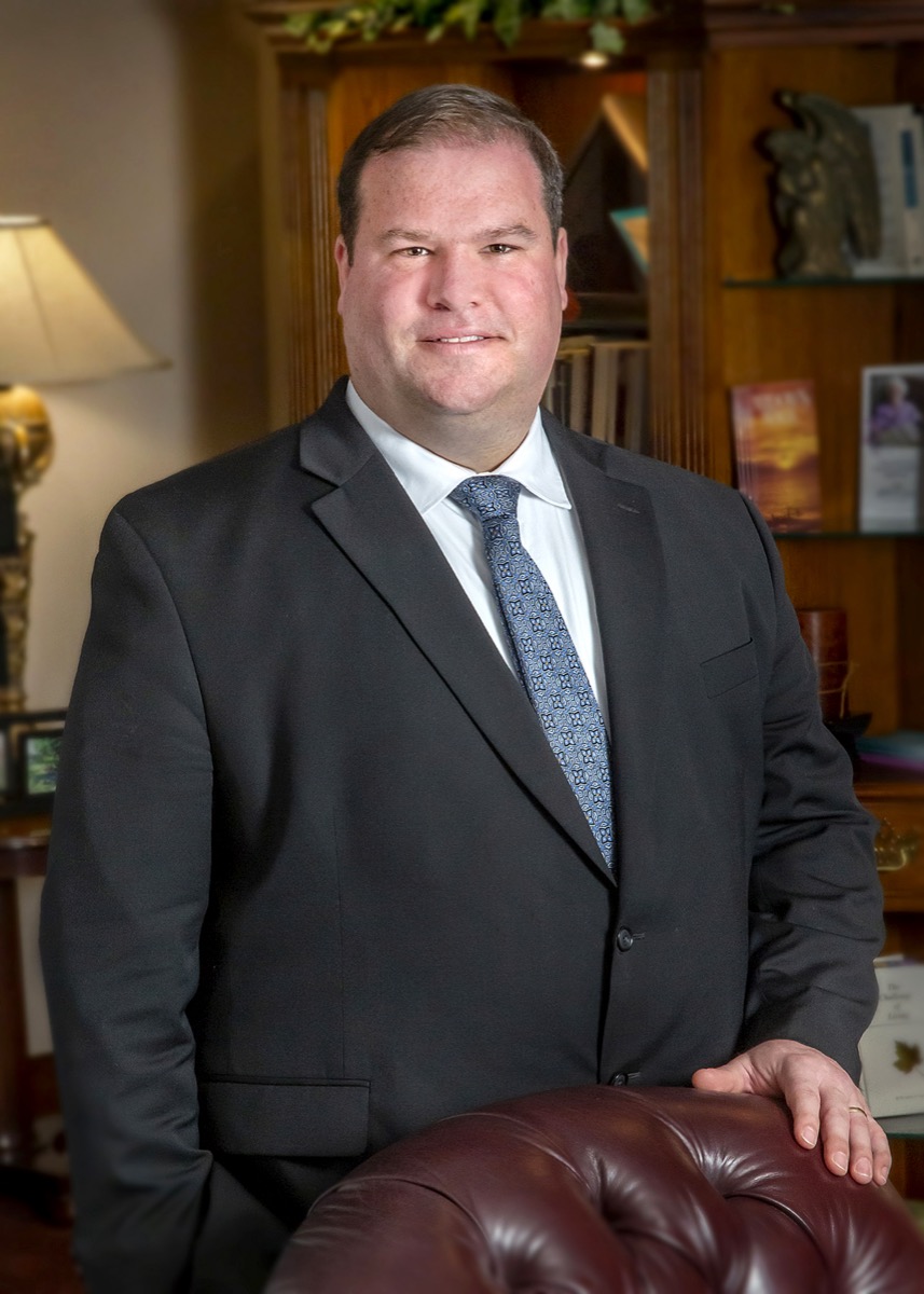 James Humphrey, founder of Humphrey Enterprise Software, standing in a funeral home office